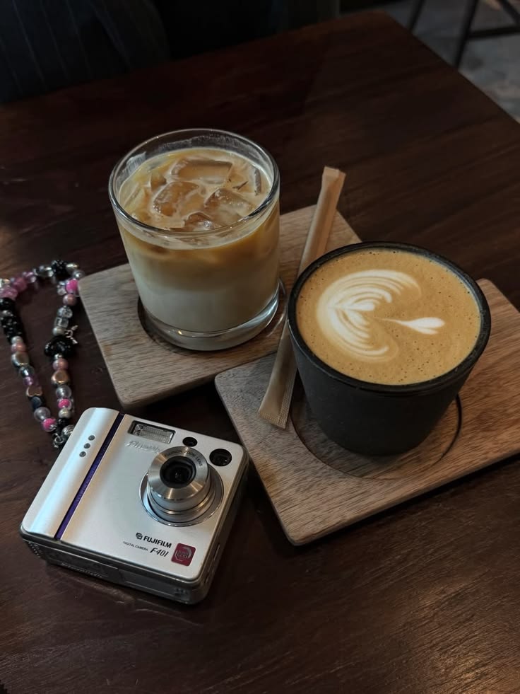 Coffee and a notebook on a sunlit table
