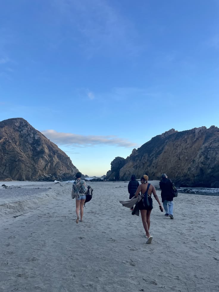 People standing at the edge of the water
